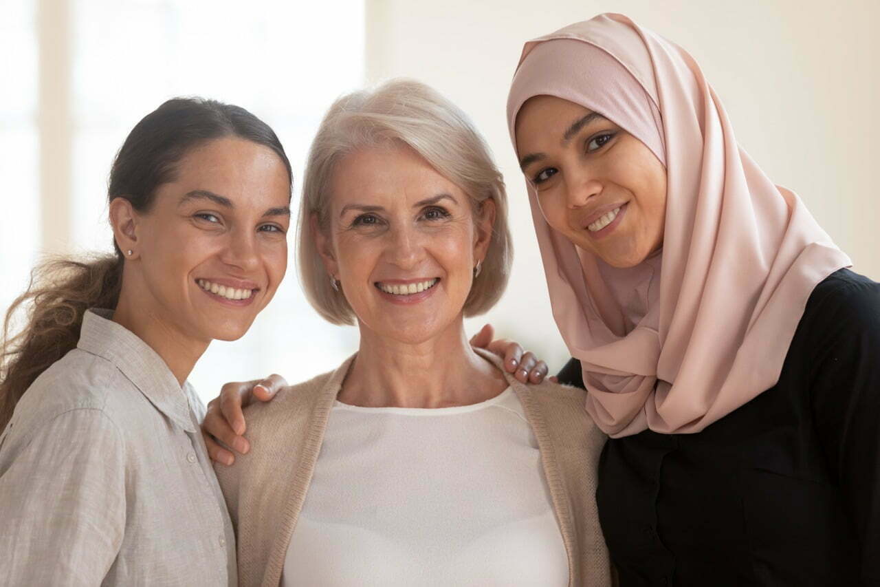 stock-photo-three-happy-beautiful-diverse-two-generation-women-young-asian-muslim-woman-wear-hijab-and-1536232268
